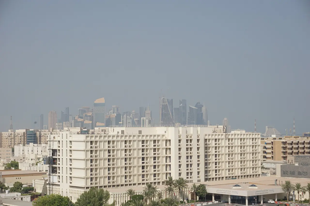 Hospital buildings in Hamad Medical City with the Doha skyline behind