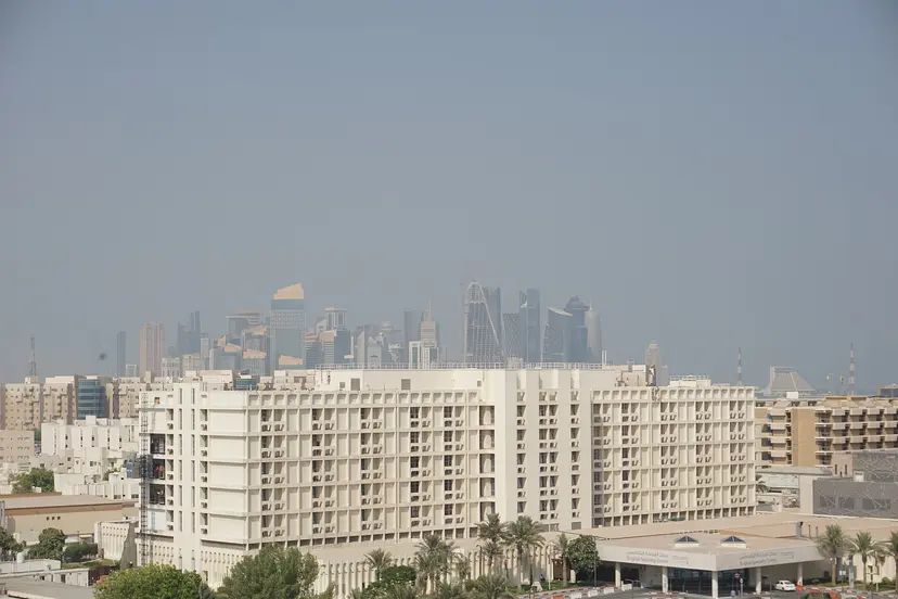 Hospital buildings in Hamad Medical City with the Doha skyline behind