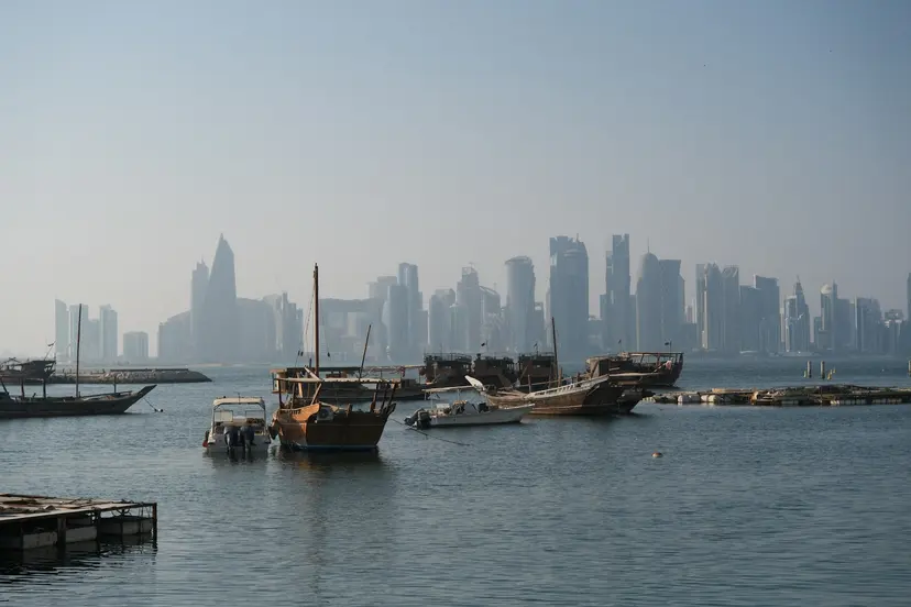 Trading dhows moored in Doha harbour with the West Bay skyline behind