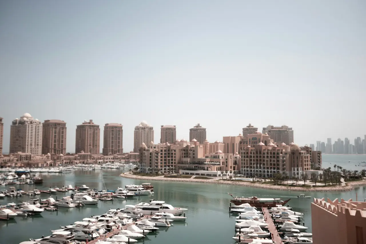 Residential towers and a marina full of boats at The Pearl, Doha