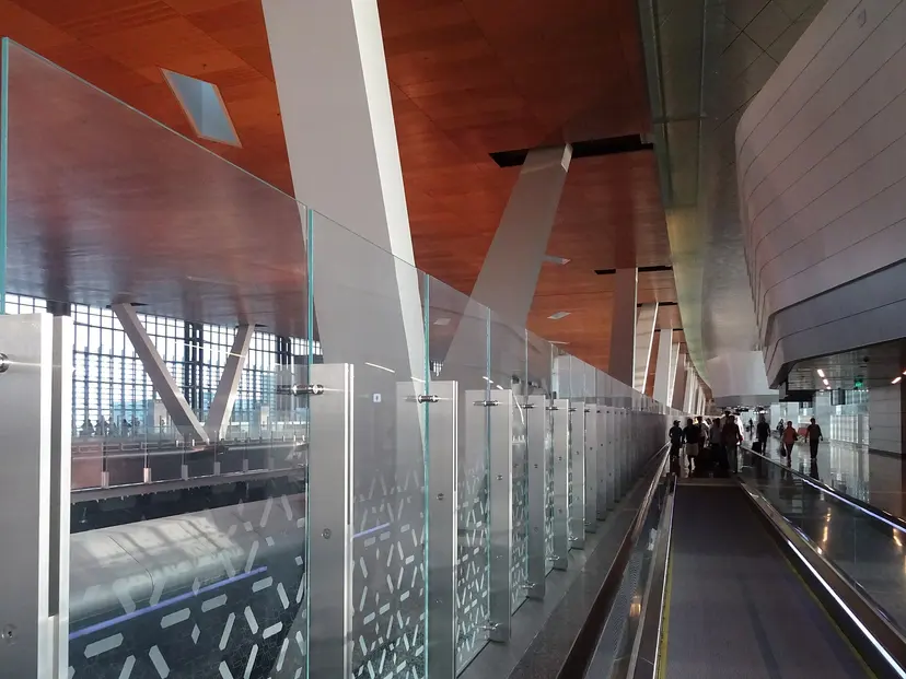 Travellers on the walkway to arrivals at Hamad International Airport, Doha