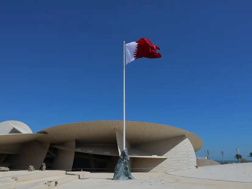 The Qatar flag flying over the National Museum of Qatar in Doha